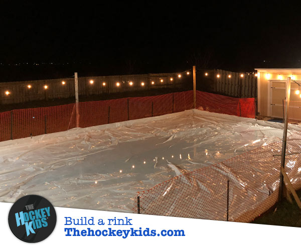 Backyard ice rink tarp flood and freeze, white tarp at night